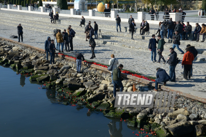 Baku residents bringing flowers to Seaside Boulevard to honor missing oil workers.  Azerbaijan, Dec.07, 2015